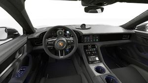 Interior view showing the steering wheel and dashboard of Taycan Turbo GT