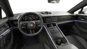 Interior view showing the steering wheel and dashboard of Panamera 4 E-Hybrid