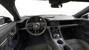 Vista interior que muestra el volante y el salpicadero de Taycan Black Edition