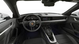 Interior view showing the steering wheel and dashboard of 911 Carrera S