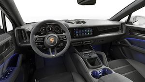Interior view showing the steering wheel and dashboard of Cayenne GTS Coupé
