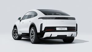 Exterior view of Cayenne Turbo Coupé Electric showing the back and left side of the car