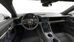 Interior view showing the steering wheel and dashboard of Taycan 4S