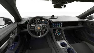 Interior view showing the steering wheel and dashboard of Taycan Turbo GT