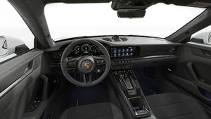 Interior view showing the steering wheel and dashboard of 911 Carrera 4 GTS