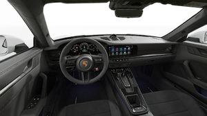 Interior view showing the steering wheel and dashboard of 911 Carrera GTS