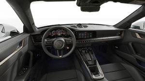 Interior view showing the steering wheel and dashboard of 911 Turbo S
