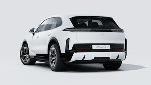 Exterior view of Cayenne Turbo Electric showing the back and left side of the car
