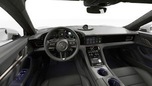 Interior view showing the steering wheel and dashboard of Taycan Turbo