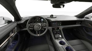Interior view showing the steering wheel and dashboard of Taycan Turbo S