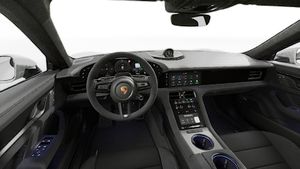 Interior view showing the steering wheel and dashboard of Taycan GTS Sport Turismo