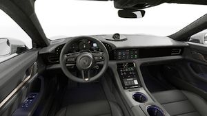 Vista interna che mostra il volante e la plancia di Taycan Turbo Sport Turismo