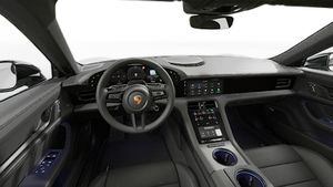 Vista interna che mostra il volante e la plancia di Taycan Sport Turismo Black Edition