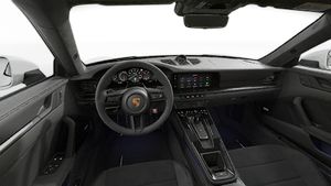 Interior view showing the steering wheel and dashboard of 911 Carrera GTS