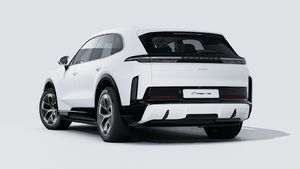 Exterior view of Cayenne Turbo Electric showing the back and left side of the car