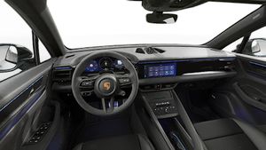 Interior view showing the steering wheel and dashboard of Macan GTS Electric