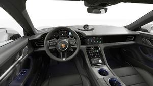 Interior view showing the steering wheel and dashboard of Taycan 4S
