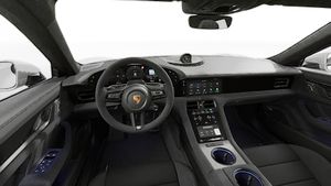 Interior view showing the steering wheel and dashboard of Taycan GTS