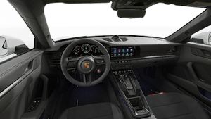 Interior view showing the steering wheel and dashboard of 911 Carrera GTS