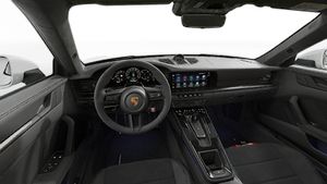 Interior view showing the steering wheel and dashboard of 911 Carrera 4 GTS