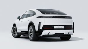 Exterior view of Cayenne Turbo Coupé Electric showing the back and left side of the car