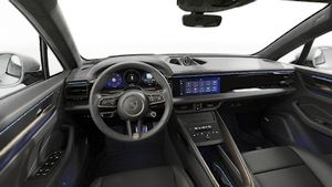 Interior view showing the steering wheel and dashboard of Macan Turbo