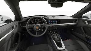Interior view showing the steering wheel and dashboard of 911 Carrera 4S