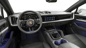Interior view showing the steering wheel and dashboard of Cayenne S E-Hybrid Coupé