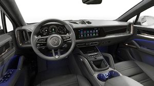 Interior view showing the steering wheel and dashboard of Cayenne Turbo E-Hybrid Coupé