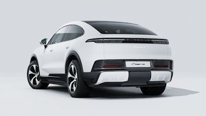 Exterior view of Cayenne S Coupé Electric showing the back and left side of the car