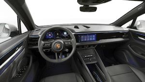 Interior view showing the steering wheel and dashboard of Macan 4S