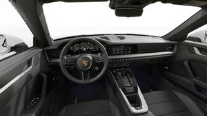 Interior view showing the steering wheel and dashboard of 911 Carrera 4S Cabriolet