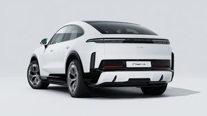 Exterior view of Cayenne Turbo Coupé Electric showing the back and left side of the car