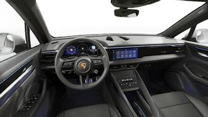 Interior view showing the steering wheel and dashboard of Macan 4S