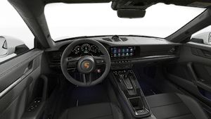 Interior view showing the steering wheel and dashboard of 911 Carrera GTS