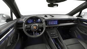 Interior view showing the steering wheel and dashboard of Macan 4S