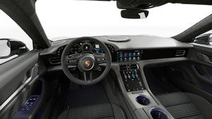 Vue de l'intérieur montrant le volant et le tableau de bord d'un véhicule de transport de marchandises. Taycan Black Edition
