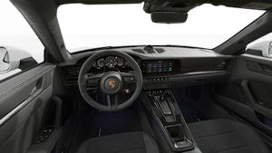 Interior view showing the steering wheel and dashboard of 911 Carrera GTS