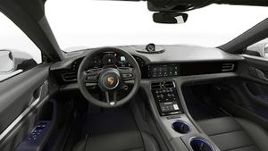 Interior view showing the steering wheel and dashboard of Taycan