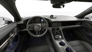 Interior view showing the steering wheel and dashboard of Taycan Turbo S