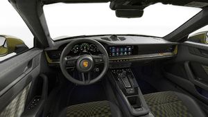 Interior view showing the steering wheel and dashboard of 911 Spirit 70