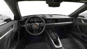 Interior view showing the steering wheel and dashboard of 911 Targa 4S