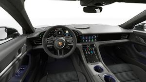 Interior view showing the steering wheel and dashboard of Taycan Black Edition
