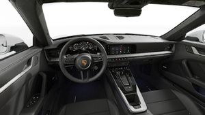Interior view showing the steering wheel and dashboard of 911 Targa 4S