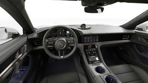 Interior view showing the steering wheel and dashboard of Taycan Turbo S