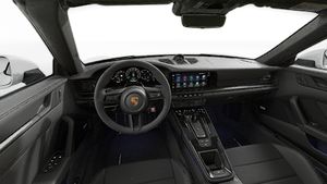 Interior view showing the steering wheel and dashboard of 911 Carrera 4 GTS Cabriolet