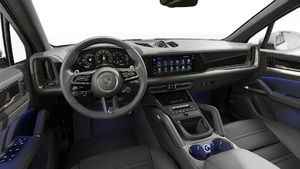 Interior view showing the steering wheel and dashboard of Cayenne Turbo E-Hybrid