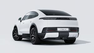 Exterior view of Cayenne S Coupé Electric showing the back and left side of the car