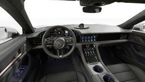 Interior view showing the steering wheel and dashboard of Taycan Turbo