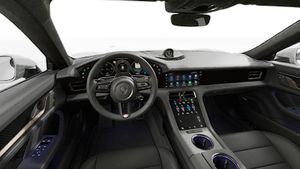 Interior view showing the steering wheel and dashboard of Taycan Turbo S